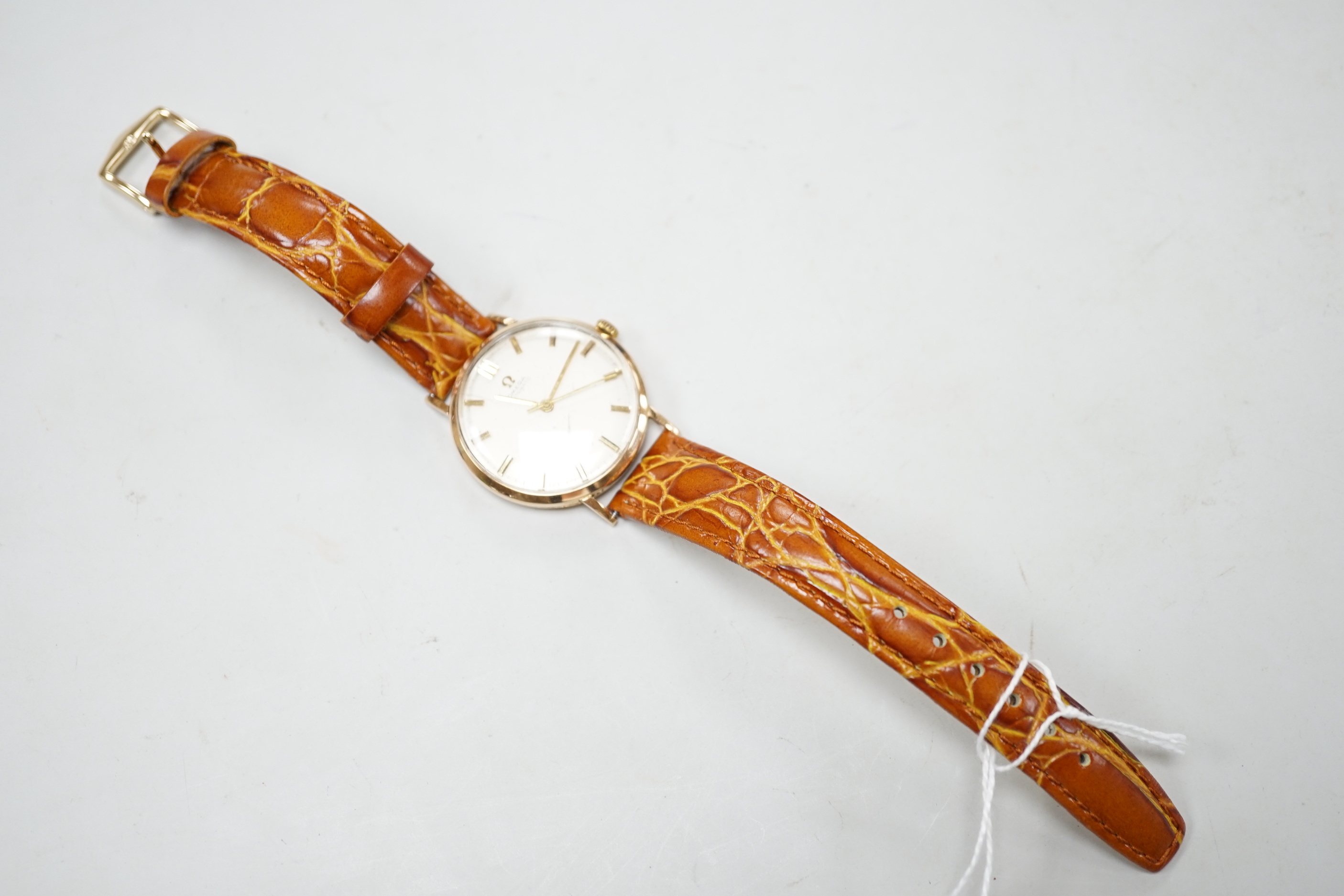 A gentleman's 1960's yellow metal Omega automatic wrist watch, movement c.552, on later associated strap, cased diameter 32mm, no box or papers.